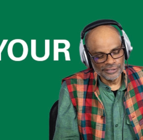 headshot with green background and white letters spelling 'your'